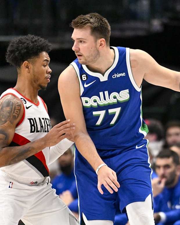 Nov 12, 2022; Dallas, Texas, USA; Portland Trail Blazers guard Anfernee Simons (1) guards Dallas Mavericks guard Luka Doncic (77) during the first quarter at the American Airlines Center. Mandatory Credit: Jerome Miron-USA TODAY Sports
